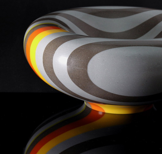 gray and orange corian bowl